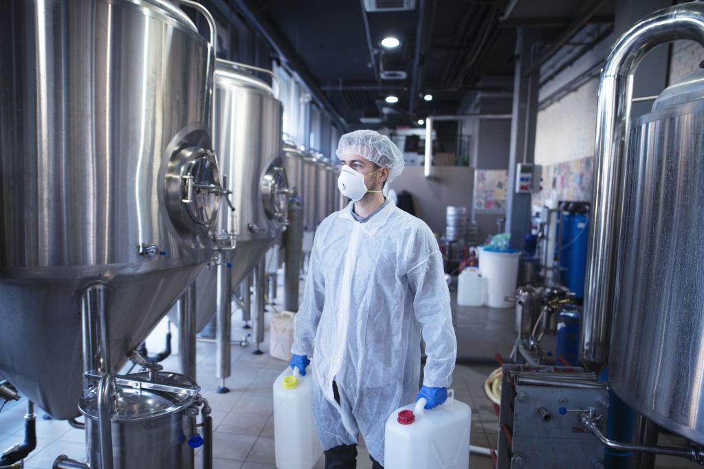 technologist-industrial-worker-holding-plastic-canisters-about-to-change-chemicals-in-the-food-processing-machine.jpg technologist-industrial-worker-holding-plastic-canisters-about-to-change-chemicals-in-the-food-processing-machine.jpg
